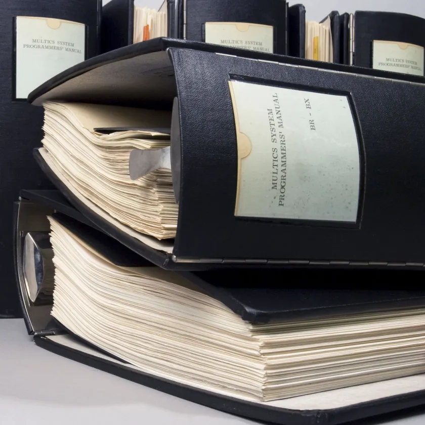 black binders on a desk